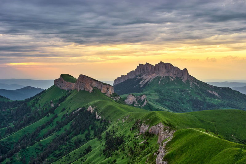 Summer sunset in the mountains with a ray of light