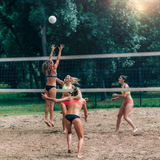 Female team playing beach volleyball
