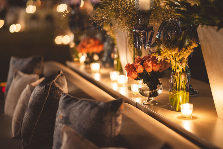 Close-up of illuminated flower pot on table