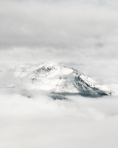 Scenic view of snow capped mountain against sky