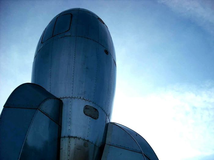 Low angle view of old air vehicle against sky