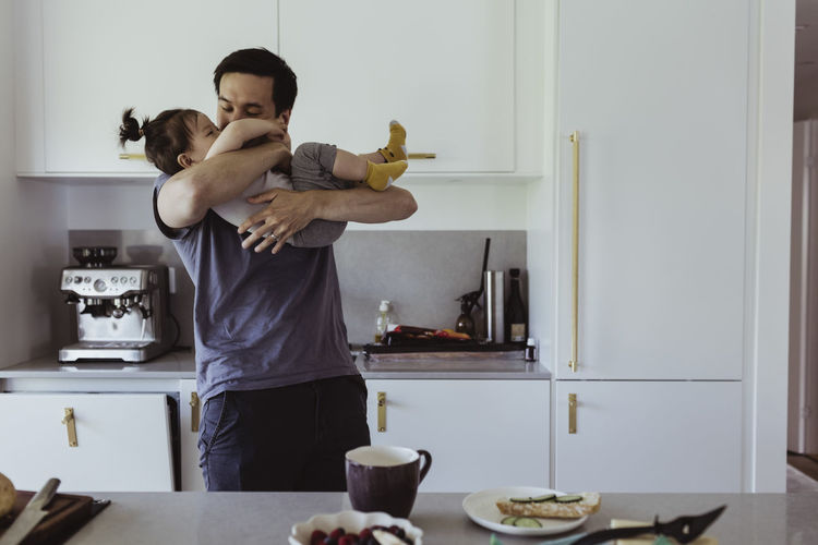 Couple holding food at home