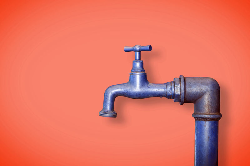 Close-up of faucet against wall