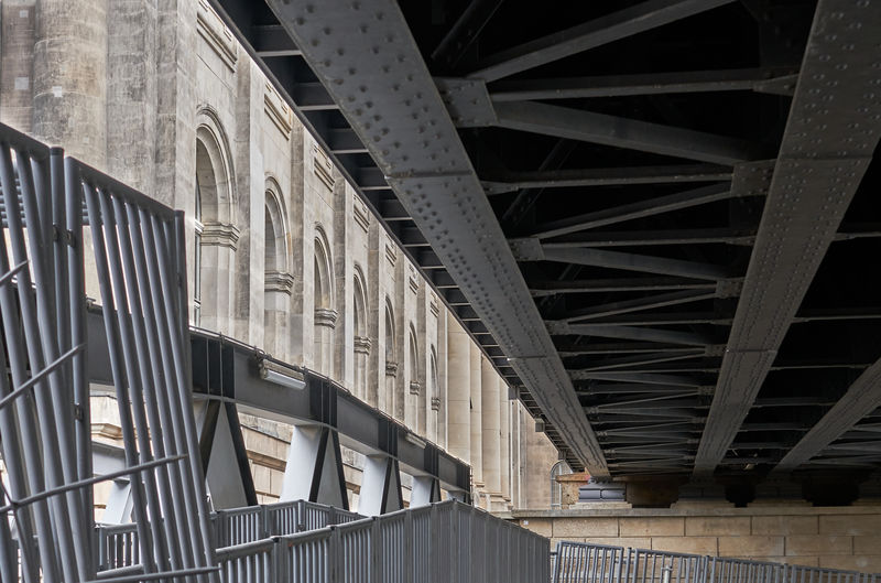 View from under urban train tracks very close to historic architecture
