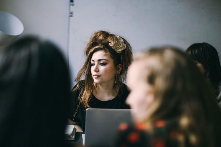 Portrait of a young woman using smart phone