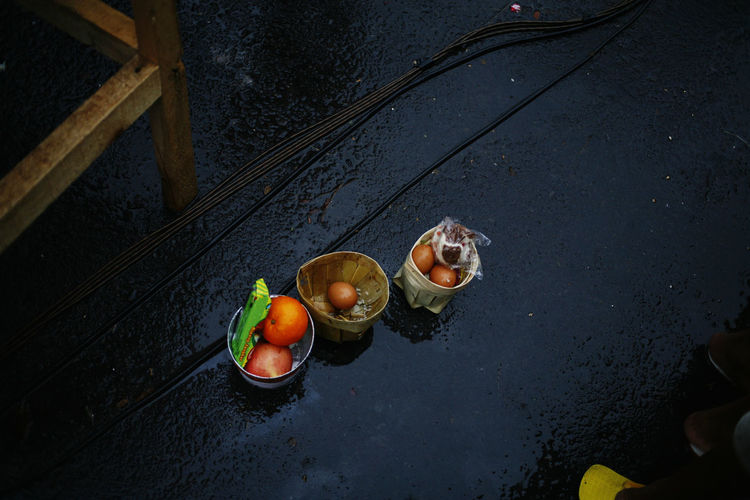 High angle view of offerings on floor