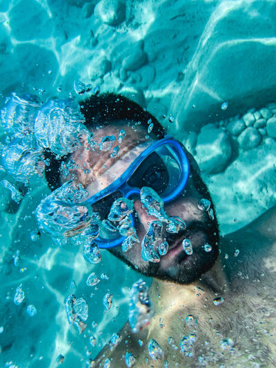 Man swimming in sea
