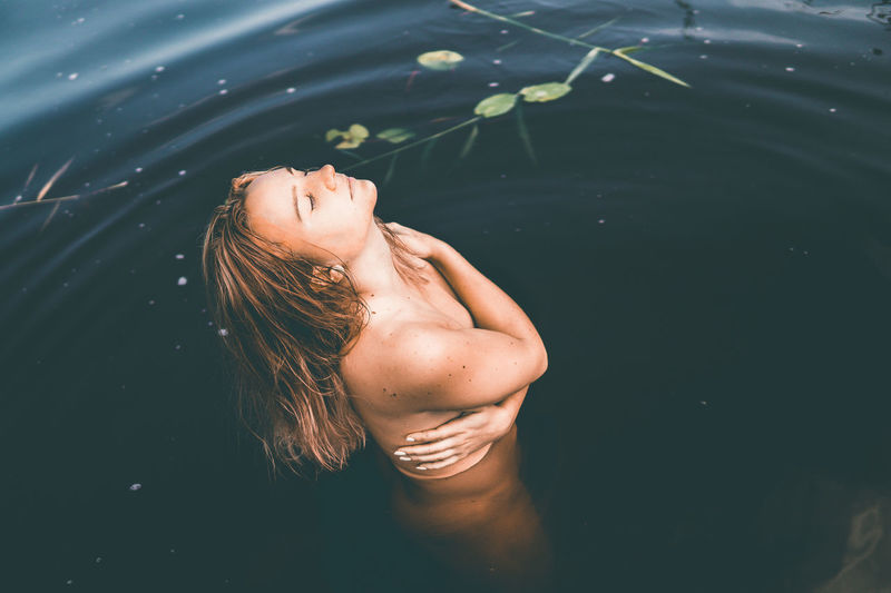 Midsection of woman in water