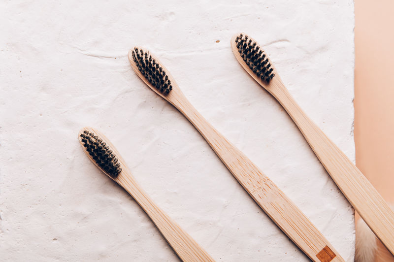 A family set of wooden bamboo toothbrushes. save the planet or no plastic concept. top view
