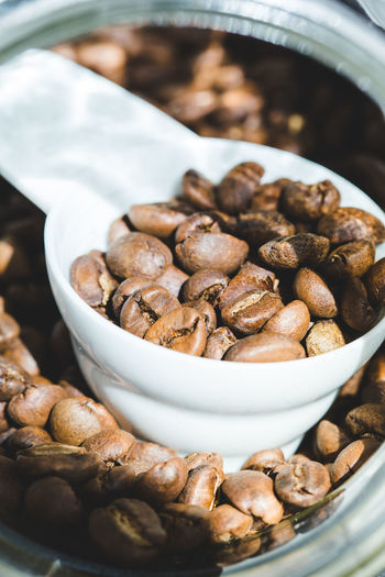 Close-up of roasted coffee beans in jar