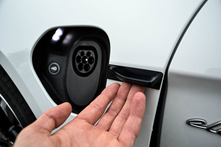Close-up of hand holding car door
