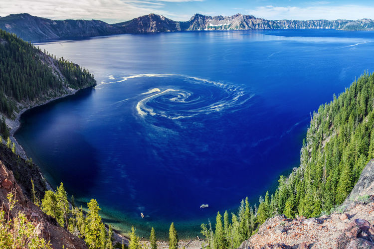 Extraordinary natural phenomenon, a giant swirl of pollen at crater lake national park, oregon