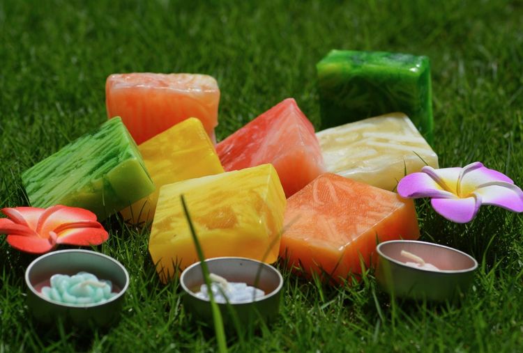 Close-up of multi colored candies on field
