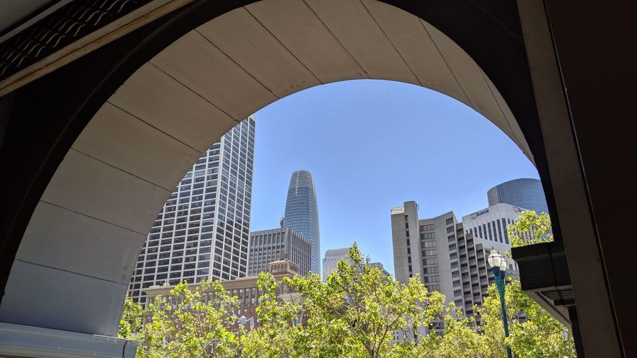 Low angle view of modern buildings against clear sky