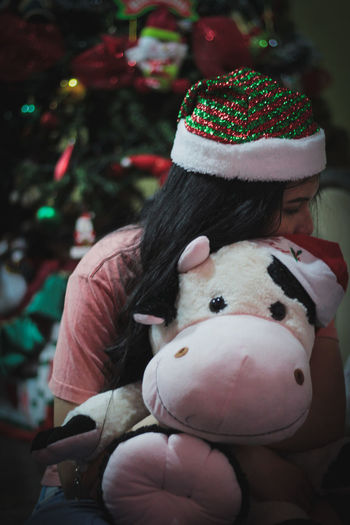 Close-up of woman holding toy