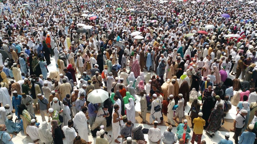 High angle view of people standing in city
