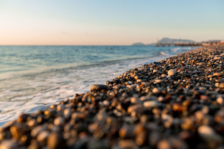 Beautiful shiny pebbles on the seashore