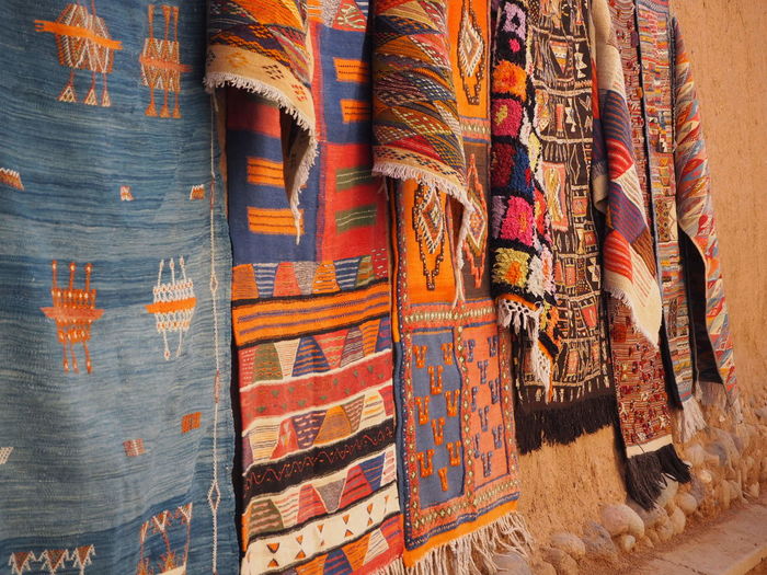Colorful fabrics hanging on wall