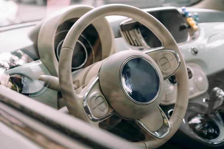 Close-up of car steering wheel and dashboard