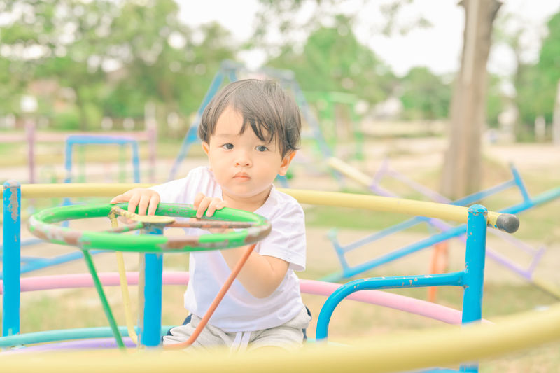 Cute boy playing in playground