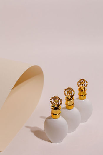 Close-up of perfume on colored background