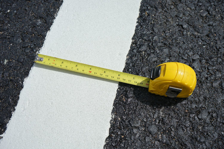 High angle view of tape measure on road