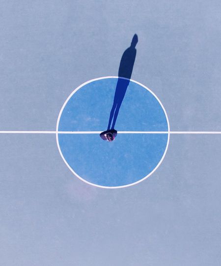 High angle view of person paragliding against clear sky