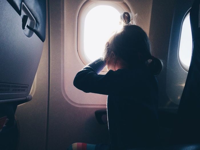 Girl sitting in airplane