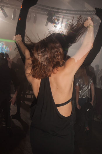 Woman dancing in nightclub