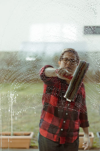 Woman cleaning outside windows