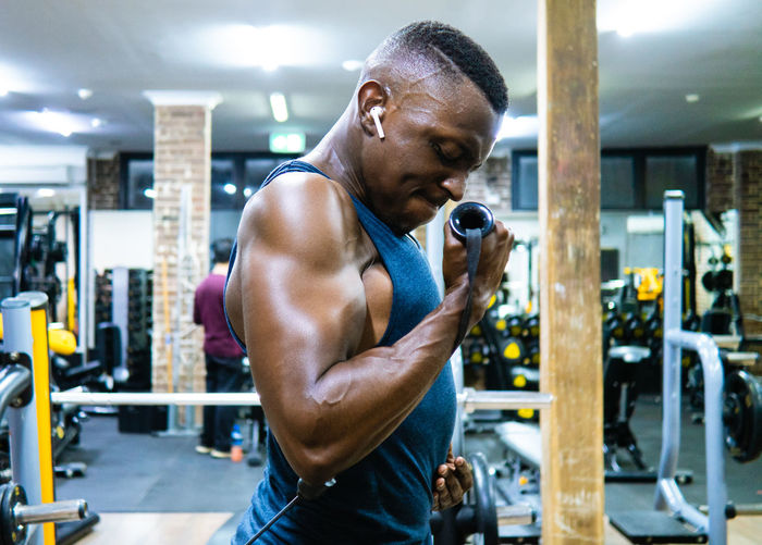 Side view of man exercising in gym