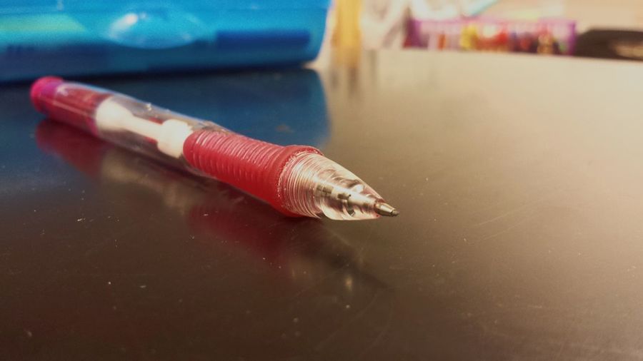 Close-up of pen on desk