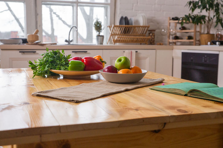 Fruits and vegetables on cutting board at home