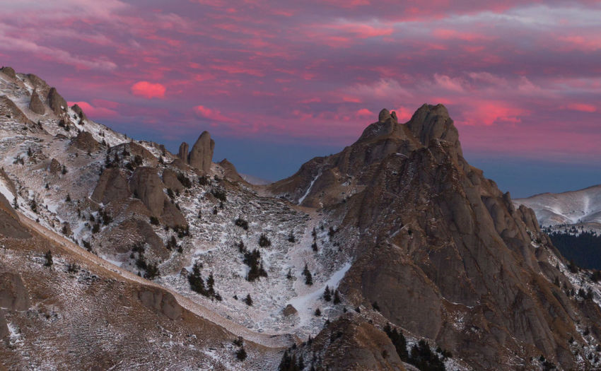 Scenic view of mountains against sky during sunset