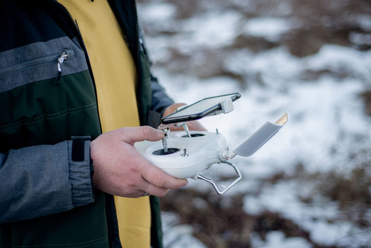 Drone operator outdoors in snow