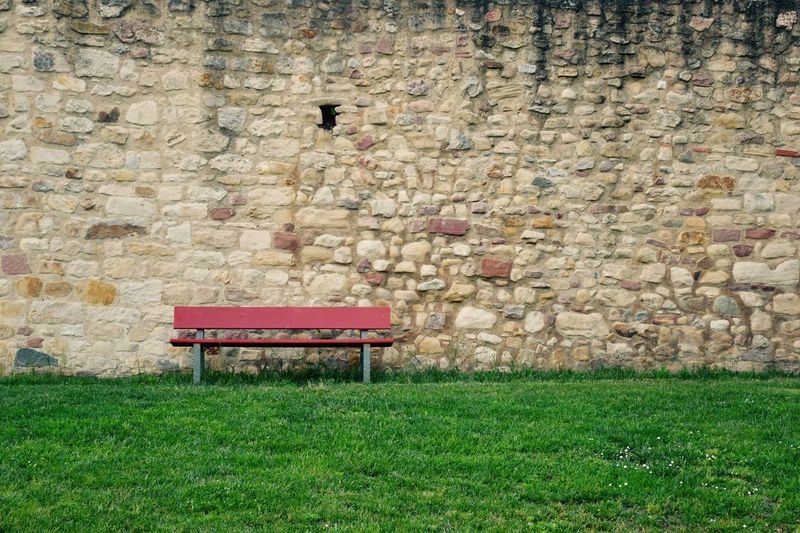 View of bench on stone wall