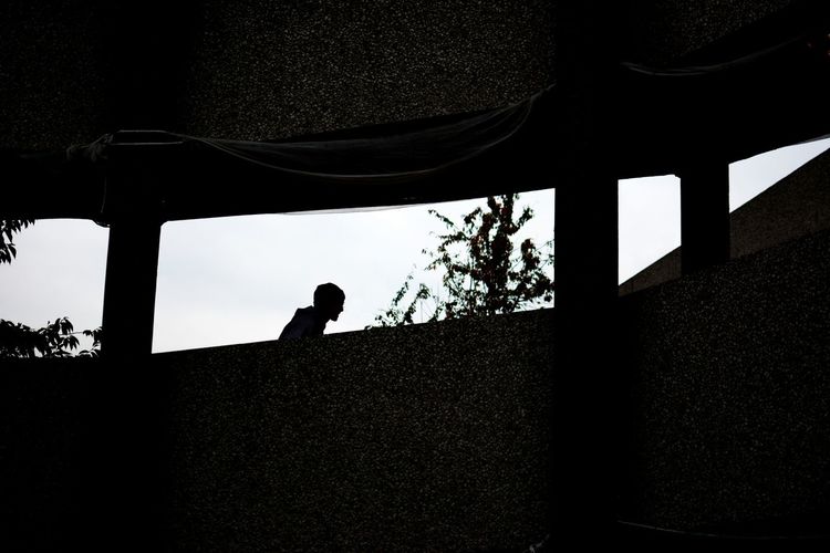 Silhouette of woman in dark background