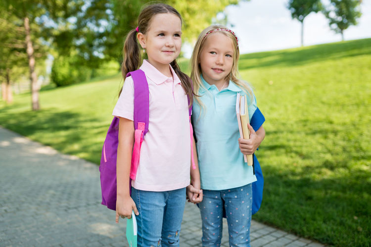 Portrait of a smiling girl standing outdoors