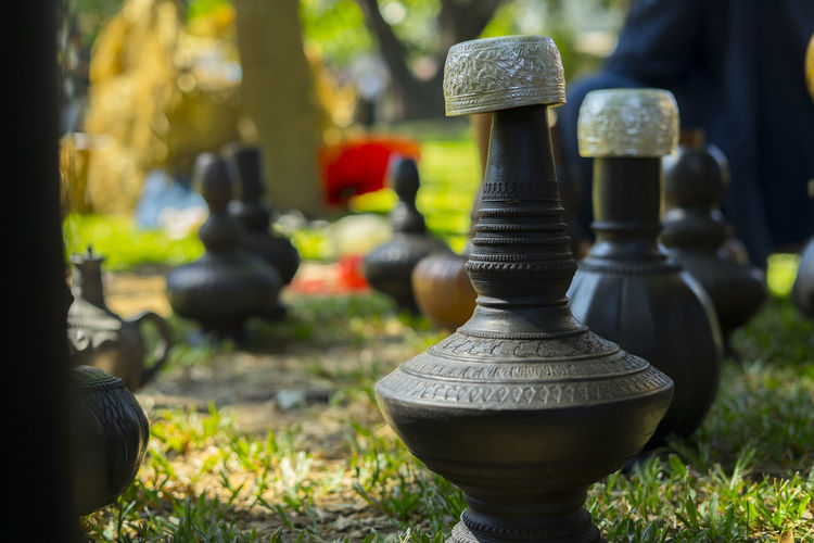 Close-up of chess pieces in park