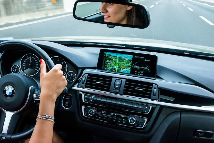 Cropped image of woman driving car