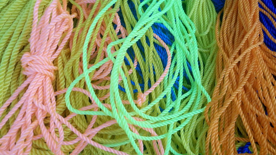 Full frame shot of tangled colorful ropes