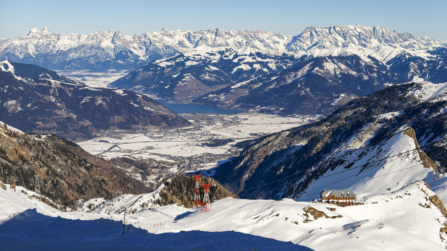 Overlook on snow sunny summits of austrian alps in winter