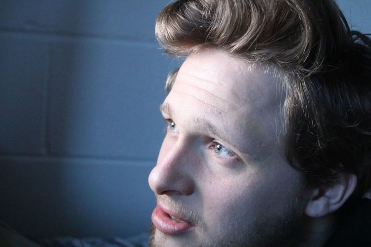 Close-up of young man looking away