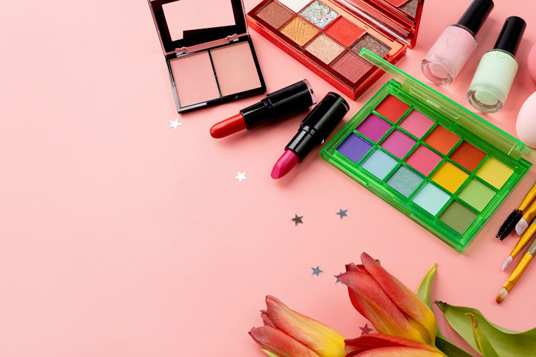 High angle view of beauty products on pink background
