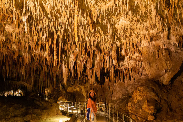 Woman exploring cave
