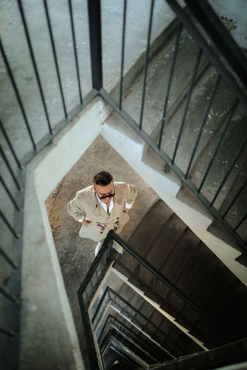 High angle view of man standing on staircase