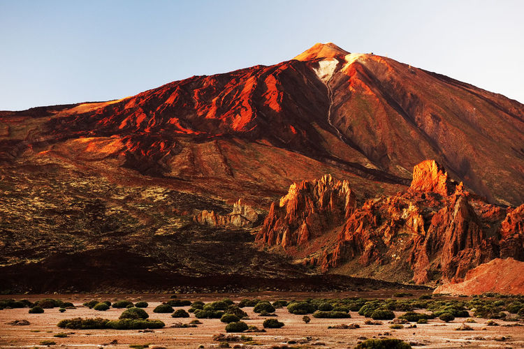Scenic view of rocky mountains at el teide national park against clear sky