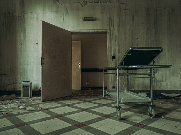 Empty chairs in abandoned building