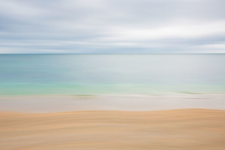 An abstract background image of a tranquil green ocean with motion blur, soft focus effect copy
