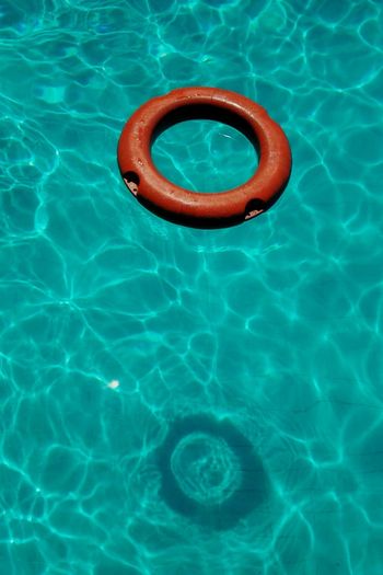 High angle view of inflatable ring in swimming pool on sunny day
